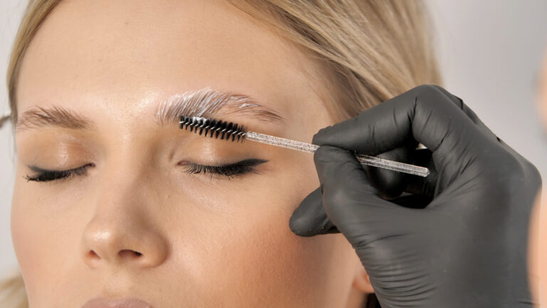 Master,Applies,Brow,Paste,With,A,Brush,To,Eyebrows